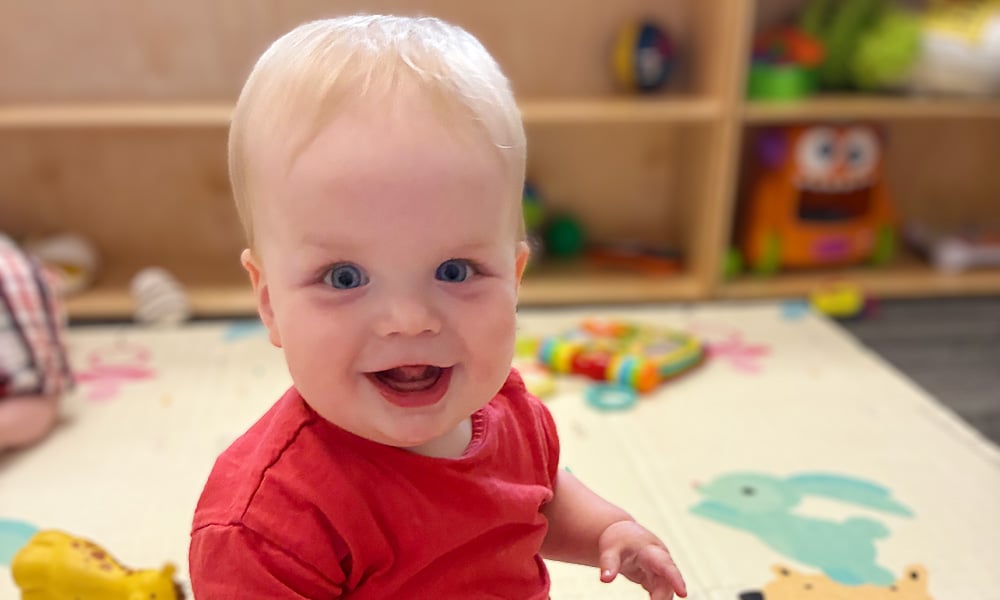 Infant child playing in a classroom