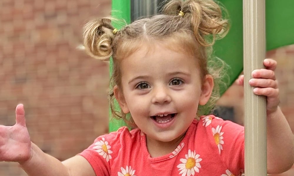Smiling toddler at the playground