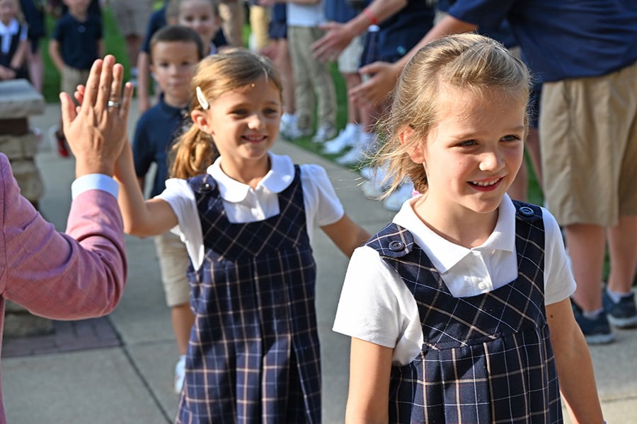Female students smiling on the first day of school